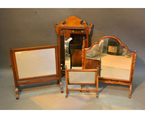 A Walnut Chippendale Style Wall Mirror together with three swing frame toilet mirrors 