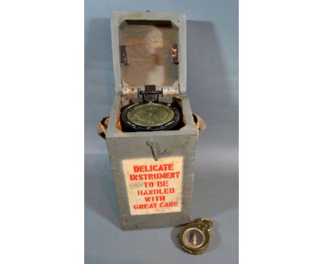 A Second World War Compass by Cruchon &amp; Emons, London together with a hand held compass 