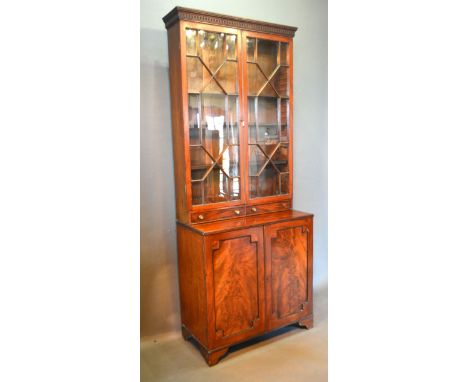 A 19th Century Mahogany Bookcase, the moulded cornice above two astragal glazed doors and two drawers, the lower section with