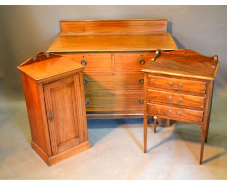 An Edwardian Mahogany Inlaid Chest of two short and two long drawers with circular brass handles raised upon bracket feet tog