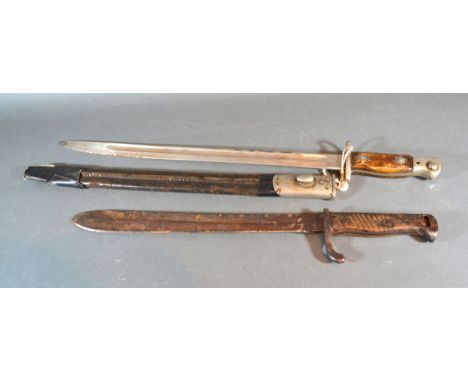 A 1907 Patent British Bayonet With Scabbard together with another German bayonet 