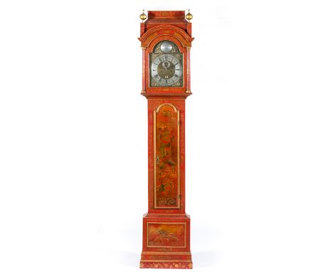 Red lacquered longcase clock, the hood with sarcophagus top, turned supports, the trunk with a lon arched door, plinth base, 