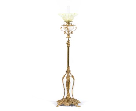 Victorian brass oil lamp, adjustable column, on elaborate cast and scrolled base, Vaseline glass shade, and opaque glass rese