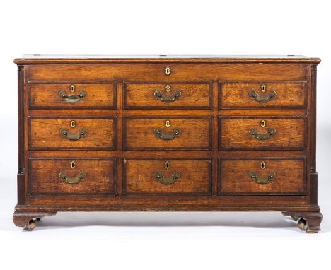 Late Georgian oak and mahogany mule chest, rectangular boarded hinged top with mahogany cross-banding, moulded edge, the fron
