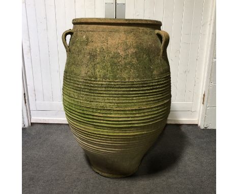 Large terracotta Ali Baba jar, with twin handles, height 99cm.SALEROOM AMENDMENT: Please note there is only one item in this 