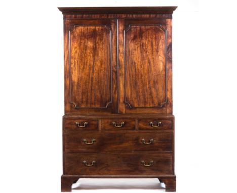 George III mahogany linen press, moulded cornice, plain frieze, the upper section with two doors, the base with drawers, brac