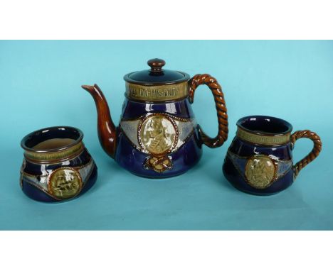 1905 Nelson Centenary: a Doulton blue glazed stoneware teapot and cover, spout and lid well restored, jug and sucrier (4)(Soc