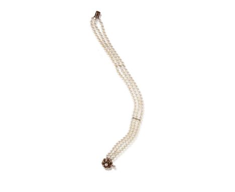 MIKIMOTO CULTURED PEARL CHOKER, three strands of cultured pearls, with two lines of yellow gold dividers, terminating onto a 