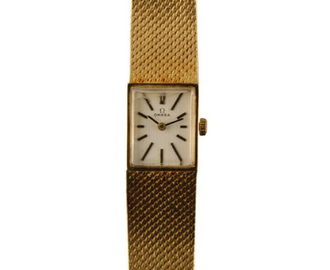 OMEGA 18CT GOLD LADY'S MANUAL WIND BRACELET WATCH with silver dial, silver baton numerals and dark blue steel hands, c.1950's