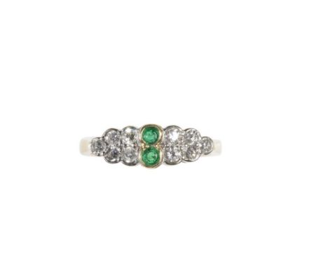 EMERALD AND DIAMOND DRESS RING, two round-cut emeralds, flanked each side by five round-cut diamonds, collet set on a yellow 