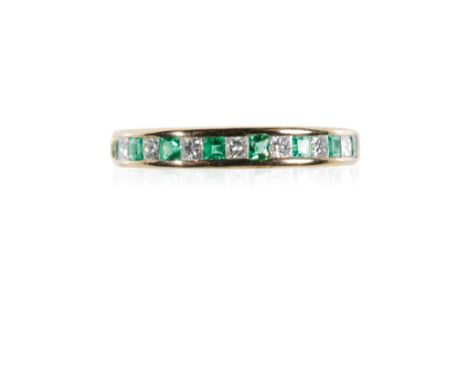 JANETTI: AN 18CT YELLOW GOLD ETERNITY RING, channel-set with eight square-cut emeralds, approximately 0.24ct total, and seven