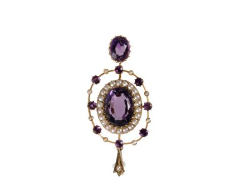 EDWARDIAN AMETHYST AND SEED PEARL pendant, the centre oval-cut amethyst surrounded by a border of seed pearls and outer open 
