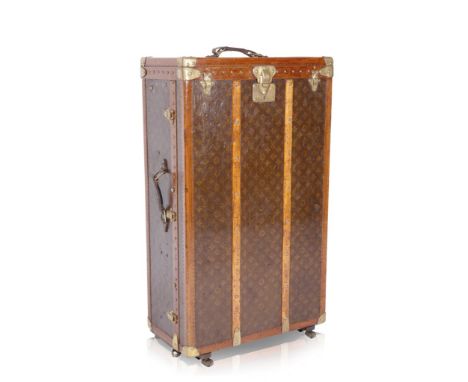 LOUIS VUITTON: A CONVERTED CABIN TRUNK the exterior with trademark monogram pattern with brass locks, hinges and studwork, th