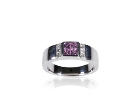JANETTI: AN 18CT WHITE GOLD DRESS RING, bezel-set with four square-cut pink sapphires, approximately 0.43ct total, and three 
