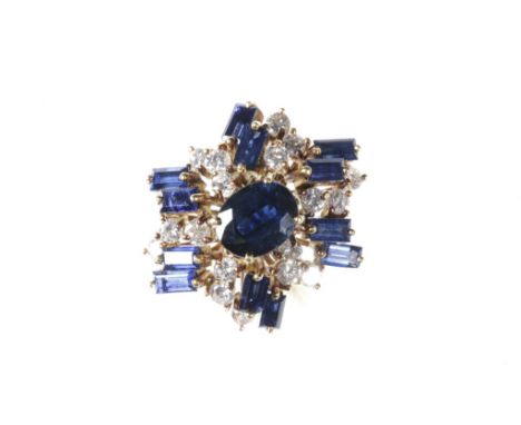 SAPPHIRE AND DIAMOND CLUSTER RING, the centre oval-cut sapphire, approximately 1ct surrounded by scattered baguette-cut sapph