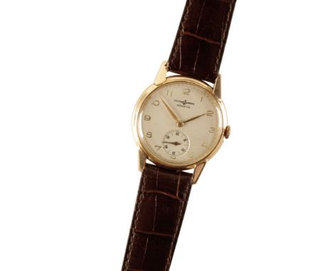 ULYSEE NARDIN 9CT GOLD GENTLEMAN'S WRIST WATCH with manual wind movement, silver dial, gold coloured Arabic numerals and hand