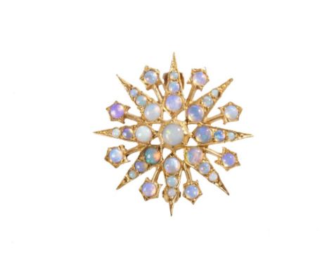 OPAL STAR BURST BROOCH / pendant, set on 9ct yellow gold, 3cm diameter.