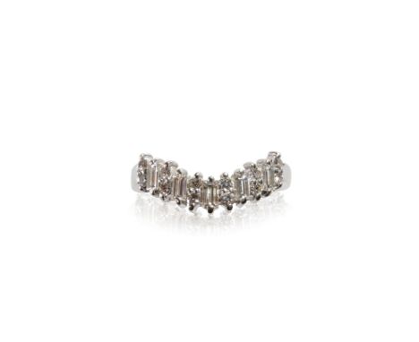 DIAMOND AND WHITE GOLD "V" SHAPED HALF ETERNITY RING, comprising five baguette-cut diamonds interspersed with two round-cut d