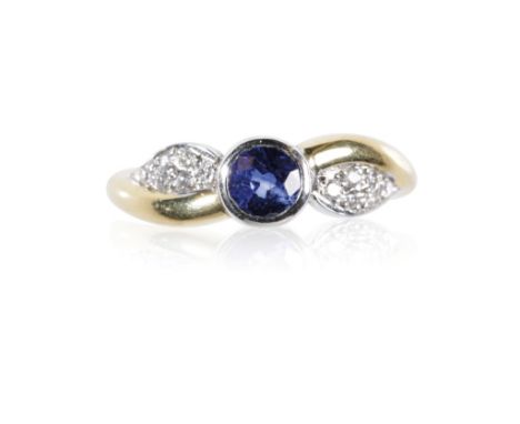 RICH HAYES: 18CT YELLOW AND WHITE GOLD RING, bezel-set with a round sapphire, approximately 0.84ct, and pave-set with brillia