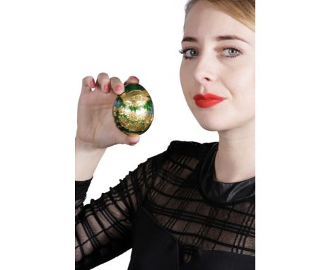 GARRARD &amp; CO GOLD AND ENAMEL "CADBURY'S CONUNDRUM " EGG, the 22ct gold egg, decorated with green and blue enamel, depicti