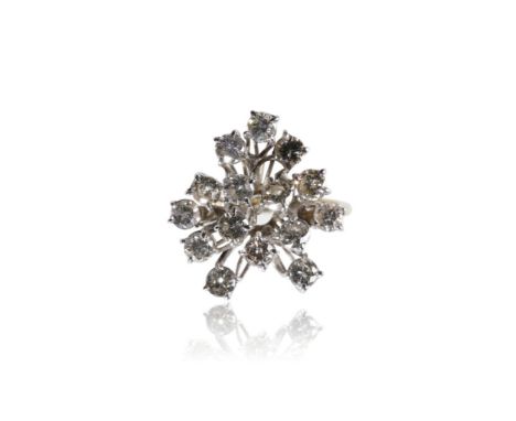 DIAMOND SPRAY DRESS RING, fifteen round-cut diamonds scattered and raised on unmarked white metal, on an 18ct yellow gold sha