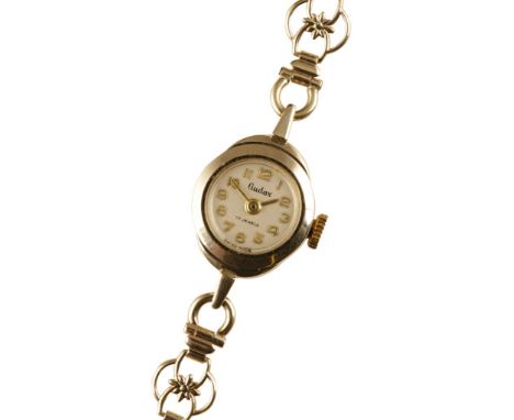LADIES 9CT GOLD BRACELET WATCH with manual wind movement, silver dial, gold Arabic numerals and gold hands, c.1950's, case di