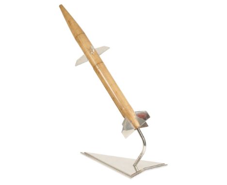 WOODEN 'BLUE WATER' MISSILE CONCEPT MODEL the sectional cylindrical body with eight chrome guidance fins, on a chrome arrow f
