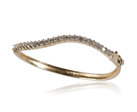 DIAMOND SET UNMARKED YELLOW METAL HINGED BANGLE, half serpentine shape set with twenty five round-cut diamonds, approximately