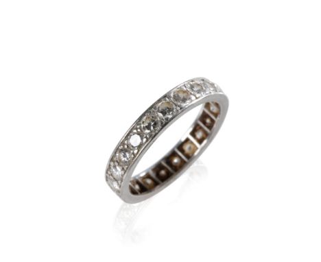 DIAMOND FULL ETERNITY RING, rub-over set on unmarked white metal. Ring size P-Q