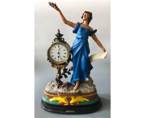 A mantel clock with indistinctly signed painted plaster of Paris figurine design, marked ‘Prosperity’ to base, height 57cm, w