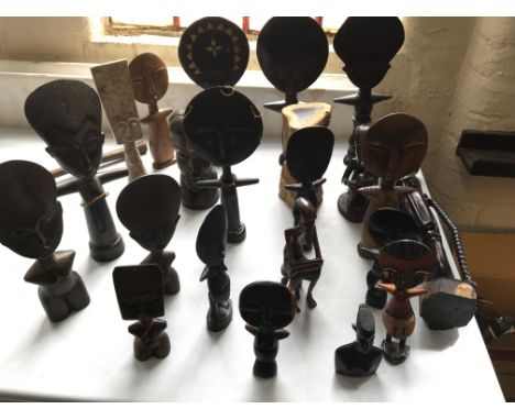 Twenty two African carved figures including Akuaba.