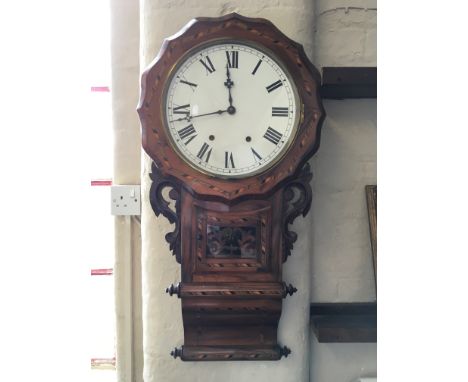 A rosewood cased with specimen wood inlay round faced wall clock with Roman numerals.