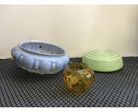 Three glass light shades in green, blue and yellow.
