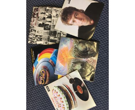 A collection of LP records, including The Police, The Rolling Stones, Michael Jackson, ELO, John Lennon, Elton John, etc.
