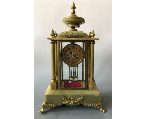 A Ch. Bertout Boulogne S/Mer onyx mercury filled pendulum mantel clock with classical style columns and detail, height 48cm.