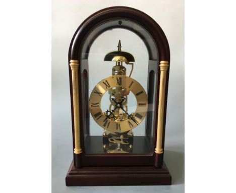 A mahogany and glass cased skeleton mantel clock, height approximately 35cm.