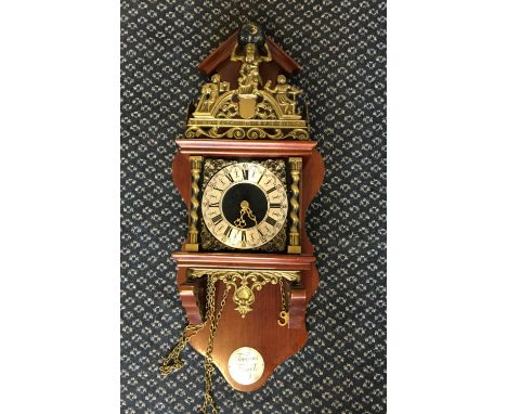 A Tempus Fugit wall clock with Father Time to top.