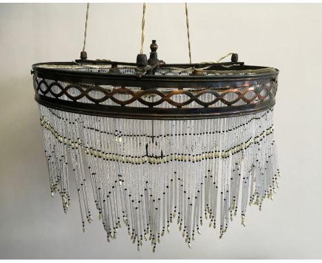 An early twentieth century ceiling light fitting with beaded droppers.
