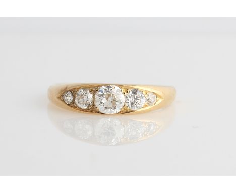 A Victorian 18ct yellow gold five stone diamond ring, set with five graduated old cut diamonds, total central diamond measuri