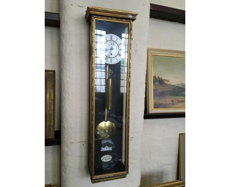A regulator wall clock built by A.H. Clarke, Birmingham.