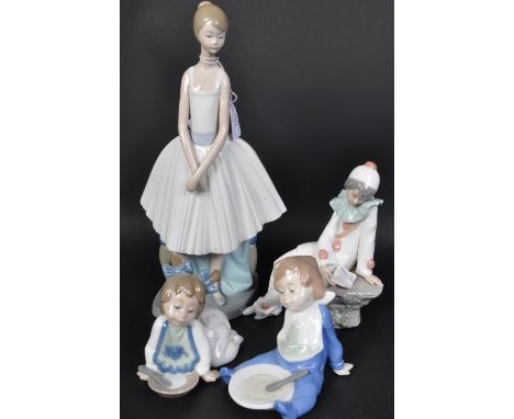 An assortment of vintage 20th century Nao by Lladro Spanish porcelain figurines. The lot to include a standing ballerina with