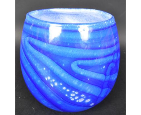 A vintage 20th Century signed studio art glass vase. In blue colourway with a bulbous body. Signed William Hauge. Measures ap