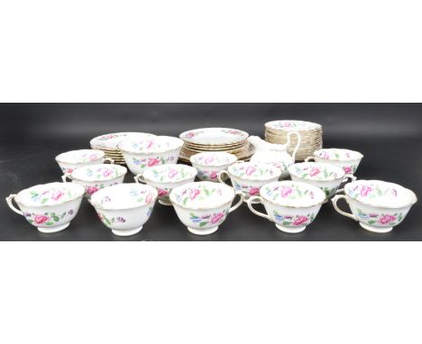 An early 20th century Chelson China, England porcelain tea service. Rd no 606451.The service in a chintz pattern to cream gro