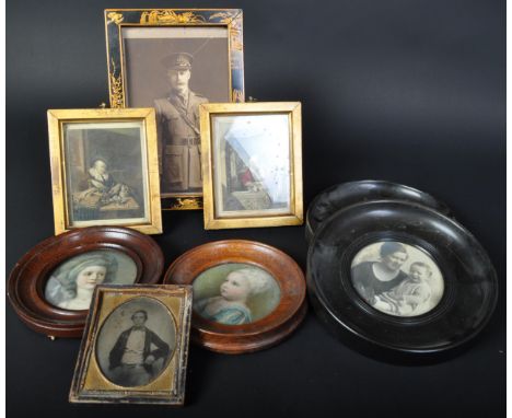 A 1920's Japanned chinoiserie decorated photograph frame of rectangular form in the manner of Liberty of London with inset ph