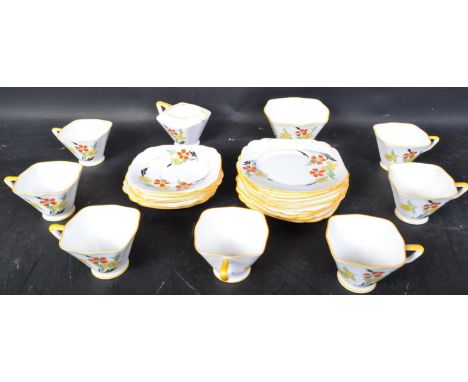 A 1930's Art Deco porcelain tea service by Standard China, Staffordshire, England. The chintz pattern design to the service, 