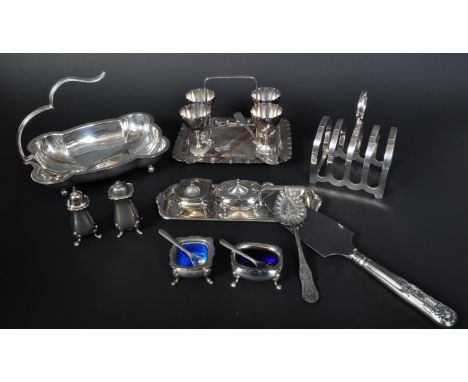 An assortment of 20th century silver plated items to include a Walker &amp; Hall egg stand / cruet set comprising of four egg