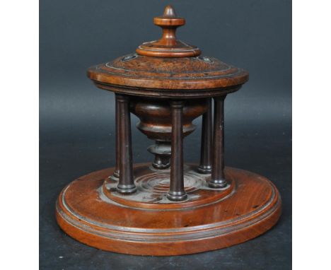 A Victorian 19th century mahogany and brass string spool holder. Circular base and brass columns with finial tops and pierced