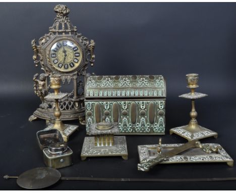 A collection of 20th century brass items to include candlesticks, a table top casket, inkwell, pen holder and West German clo