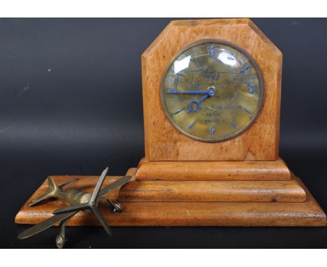 A vintage 20th century Rolls Royce Tech College Bristol mantel clock having gilt face with blue details to depict a plane, se
