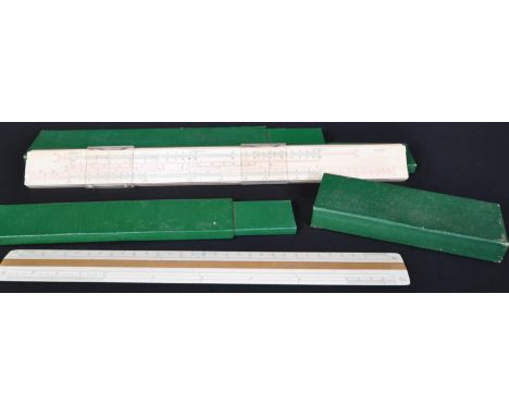 A pair of Faber - Castell German manufactured cased slide rules. For business, mathematics and architectural use. With argini